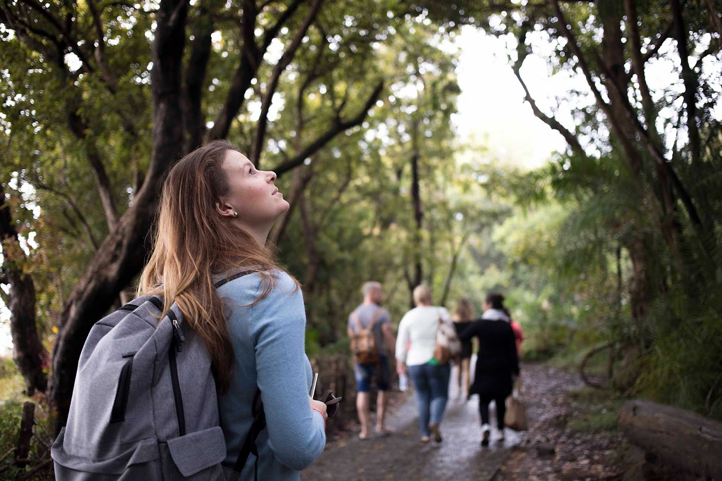 Allison-bothma-rhino-africa-travel-consultant Allison Bothma, a Rhino Africa travel expert, exploring a forested area