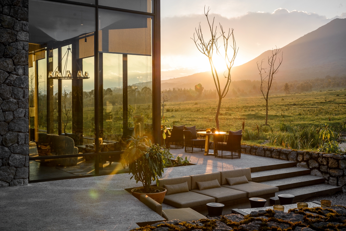 Singita-Kwitonda-Lodge-Volcanoes-National-Park-volcanoe-views Main outdoor deck area with picturesque views of the landscape