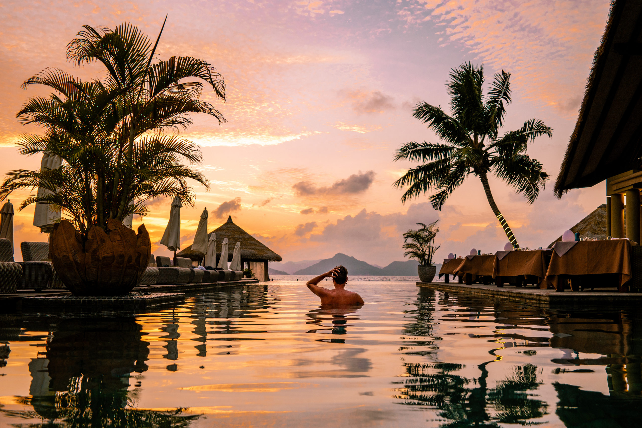 luxury-swimming-pool-tropical-resort-sunset-seychelles luxury-swimming-pool-tropical-resort-sunset-seychelles